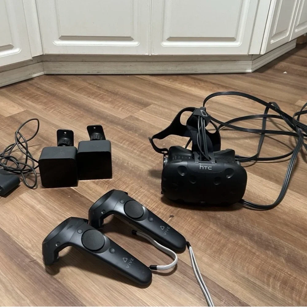 HTC VR Headset with Black Controllers and Sensors